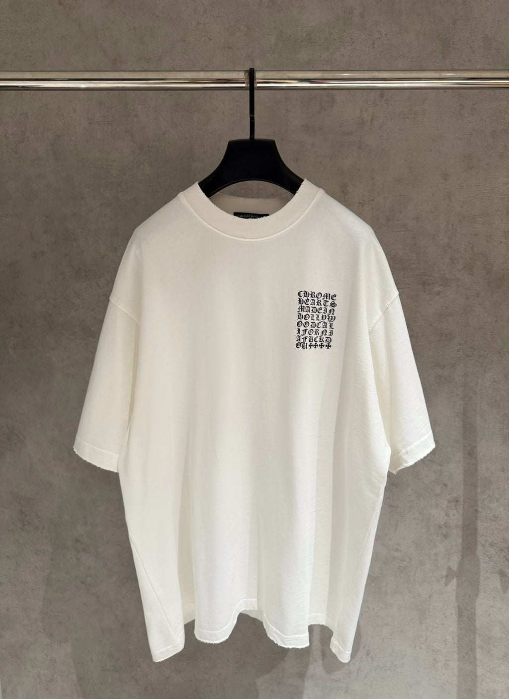 White short-sleeve T-shirt with small chest logo print