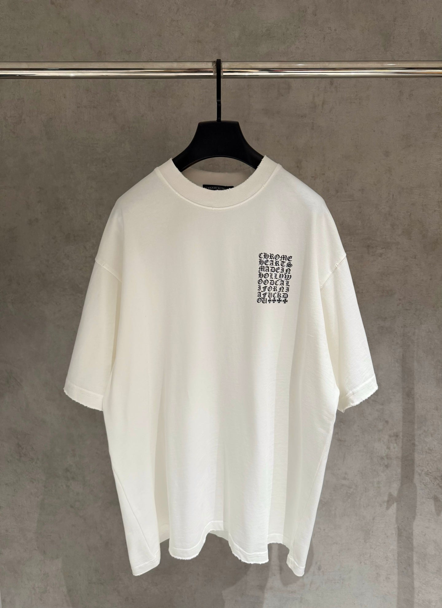 White short-sleeve T-shirt with small chest logo print