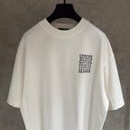 White short-sleeve T-shirt with chest typography and logo graphic