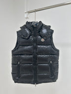 Moncler dark navy hooded puffer vest with front zipper and logo chest patch