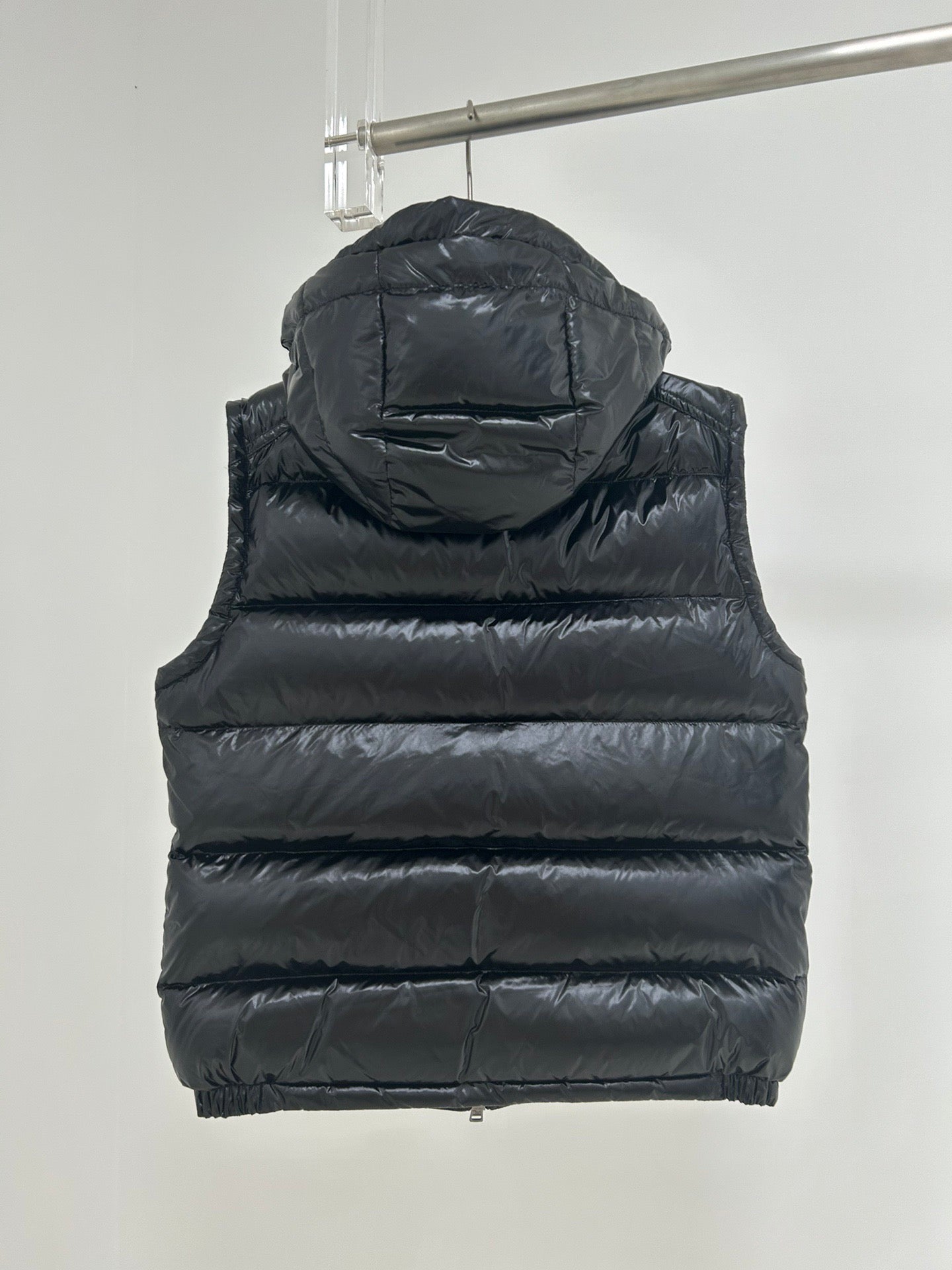 Moncler dark navy hooded puffer vest back with horizontal quilting and zipper hem