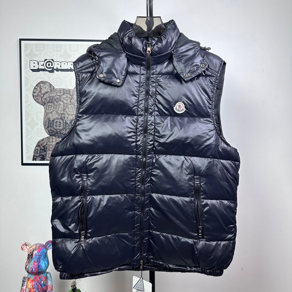 Moncler dark navy hooded puffer vest with front zipper and logo chest patch