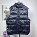 Moncler dark navy hooded puffer vest with front zipper and logo chest patch