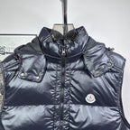 Moncler dark hooded puffer vest with front zipper and chest logo patch
