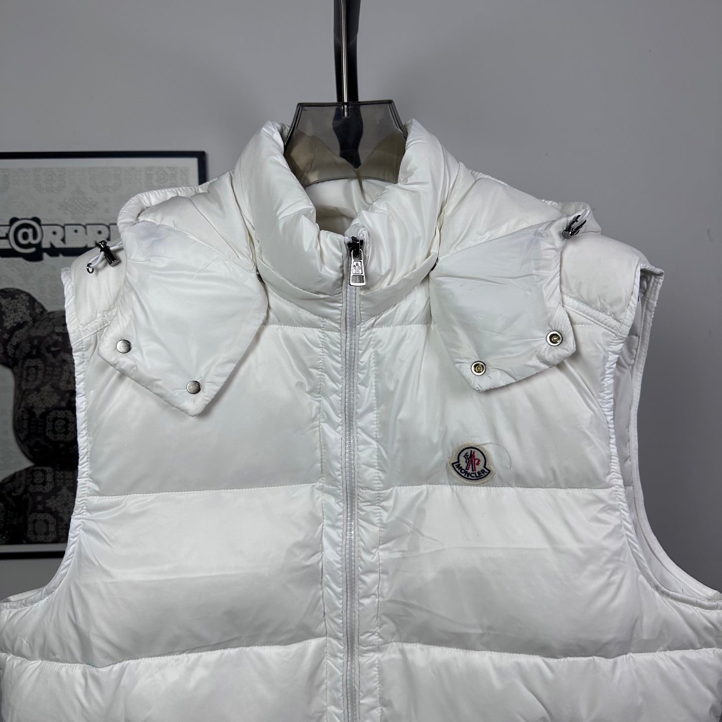 Moncler hooded puffer vest, white, front view with snap shoulder buttons