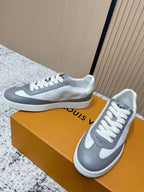 Leather low-top sneakers, white and gray color-block design, white laces, side logo