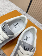 Sneakers with interior branding and large logo on tongue, white laces, gray heel panel