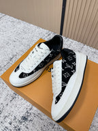 Louis Vuitton unisex sneakers, side view with black monogram upper and white laces