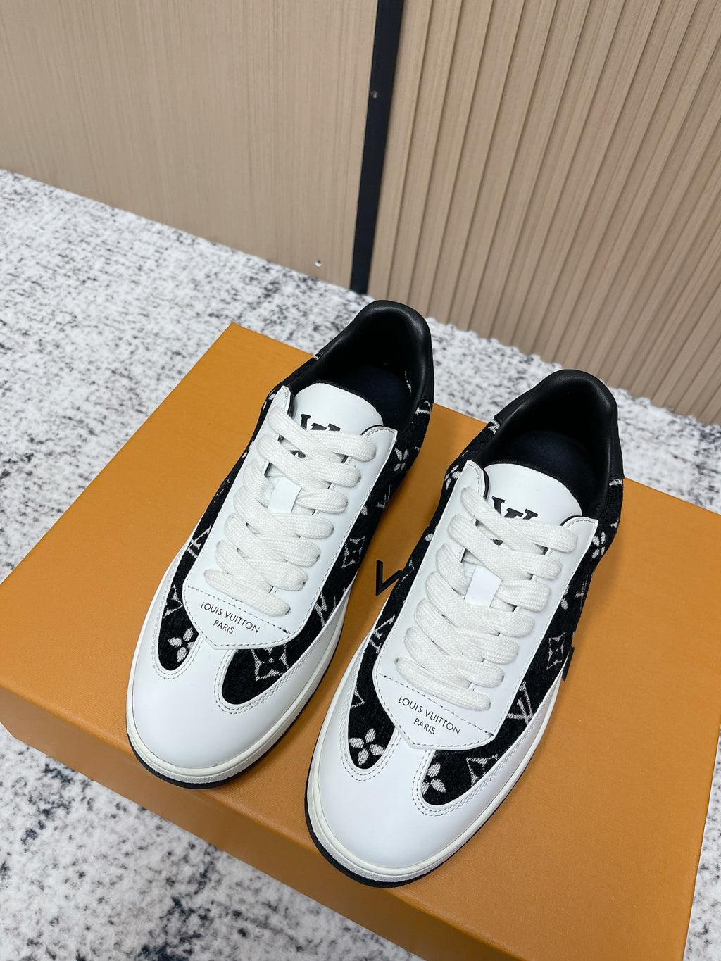 Louis Vuitton unisex sneakers in white with black monogram panels, white laces