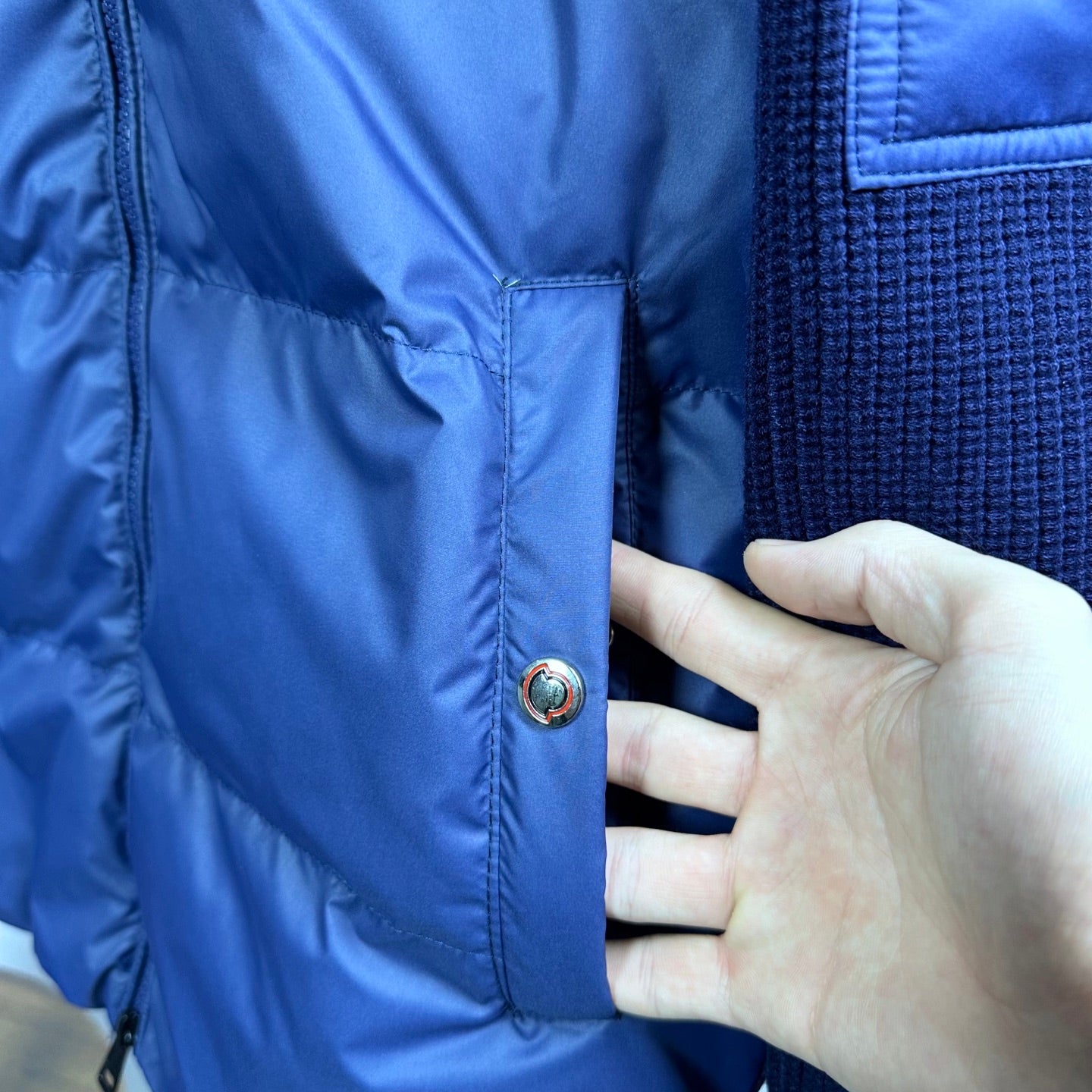Blue Moncler padded jacket front with snap placket and quilted panels
