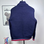 Dark blue Moncler padded jacket with ribbed stand collar and knit texture