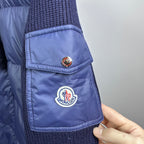 Dark blue Moncler padded jacket with chest pocket and circular logo patch