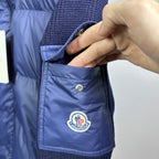 Dark blue Moncler padded jacket chest pocket with snap button and logo patch