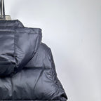 Long Moncler puffer jacket back with dark navy quilted hood and padded shoulders