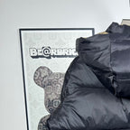Long Moncler puffer jacket back view with dark navy hood and quilted stripes