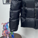 Long Moncler puffer jacket with dark navy quilted body and front zip