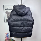 Long Moncler puffer jacket with dark navy hood and layered quilted padding