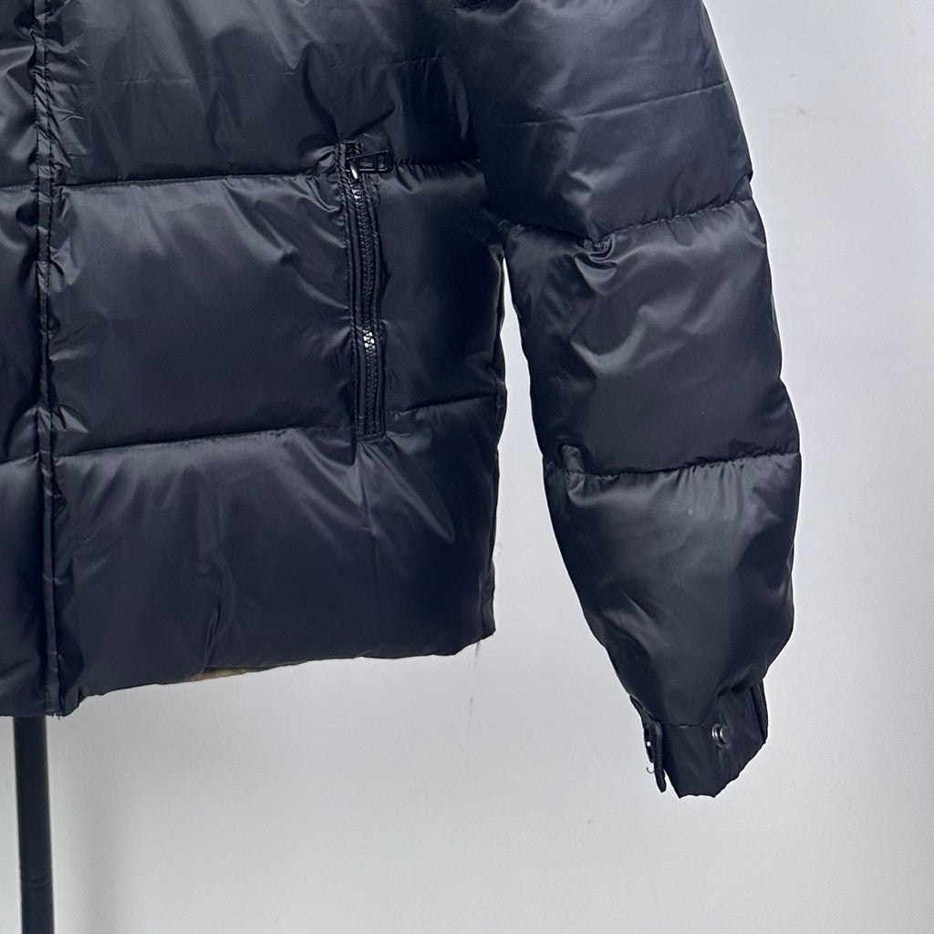 Long Moncler puffer jacket with dark navy quilted panels and center front zipper