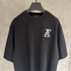 Black short-sleeve T-shirt with Louis Vuitton logo patch on chest
