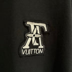 Black T-shirt with embroidered Louis Vuitton logo patch on chest
