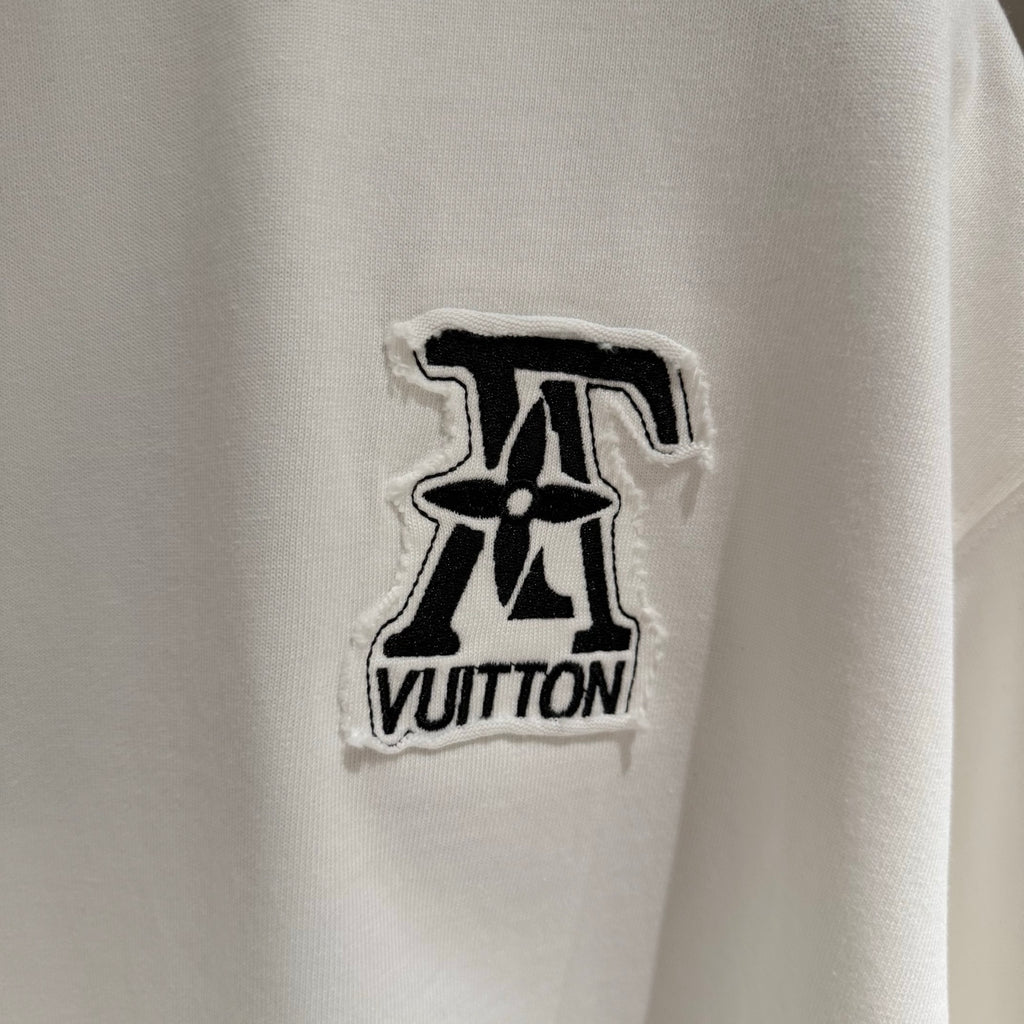 White T-shirt with embroidered black Louis Vuitton logo patch on chest
