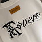White T-shirt with large embroidered 'Tovers' graphic and brown neck tag