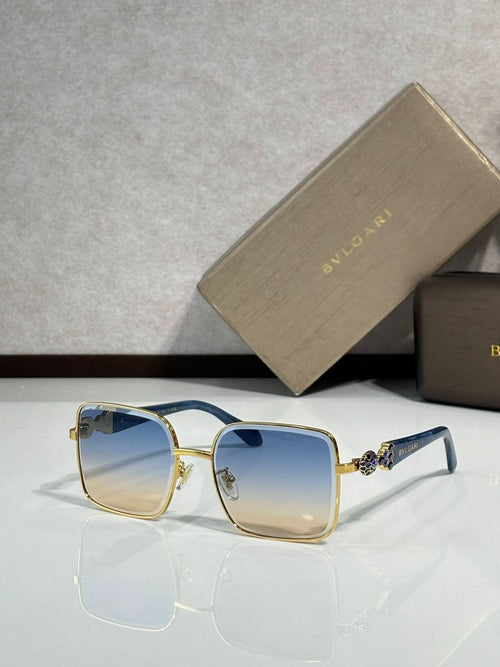 Bvlgari glasses with gold frame and blue-tinted rectangular lenses
