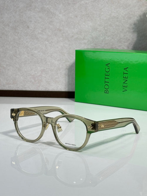 Bottega Veneta eyeglasses with olive frame and gold textured temples