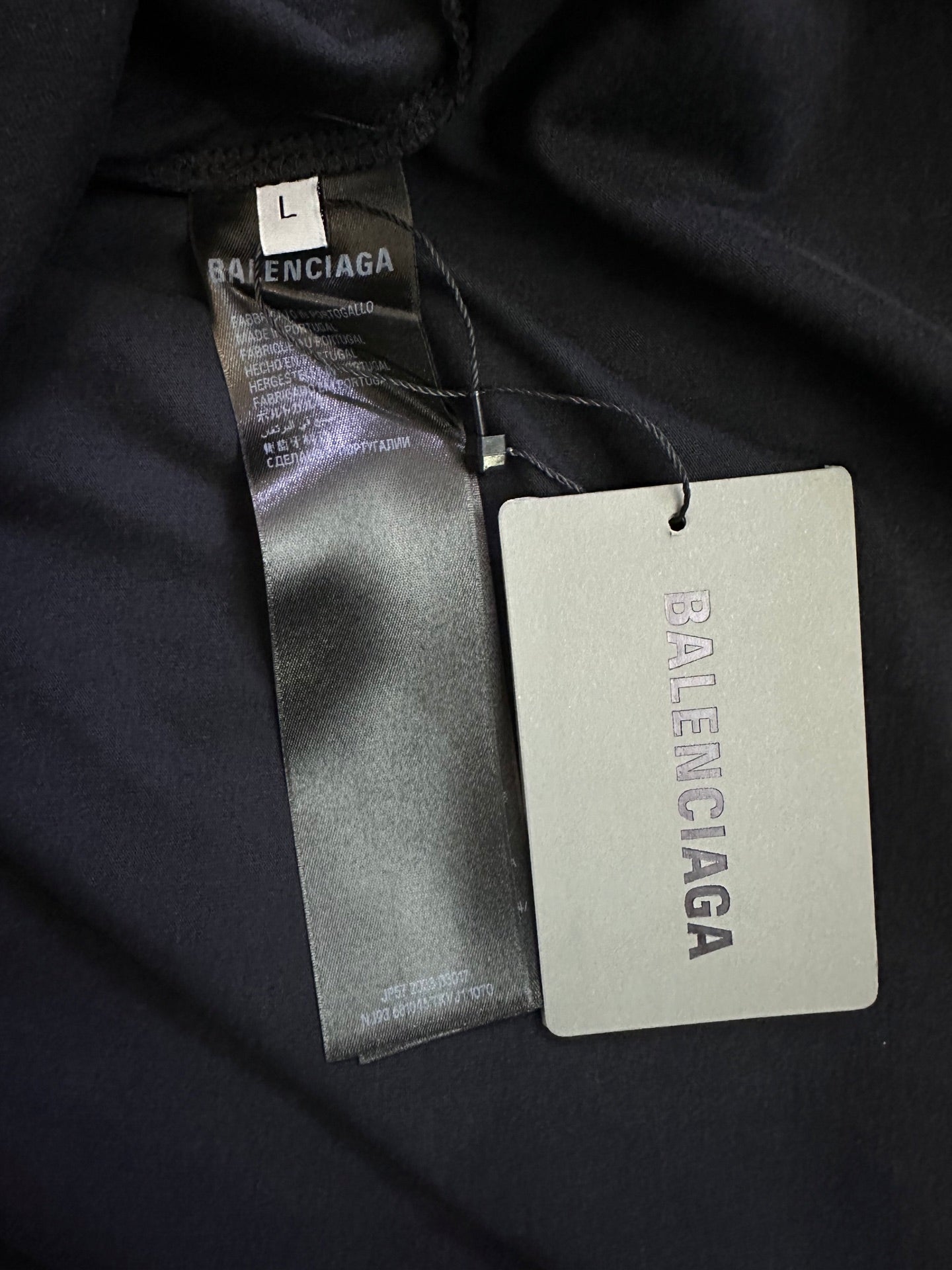 Balenciaga long-sleeve top fabric closeup, interior labels and size tag
