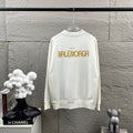 White long-sleeve sweatshirt with crew neck and gold Balenciaga lettering print