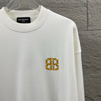 White crew-neck sweatshirt with small gold Balenciaga monogram on the chest