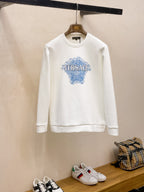 Crewneck sweatshirt in white with Versace blue graphic logo on chest.