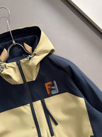 Navy and light yellow windbreaker jacket front with zip, logo patch, and drawstring tabs