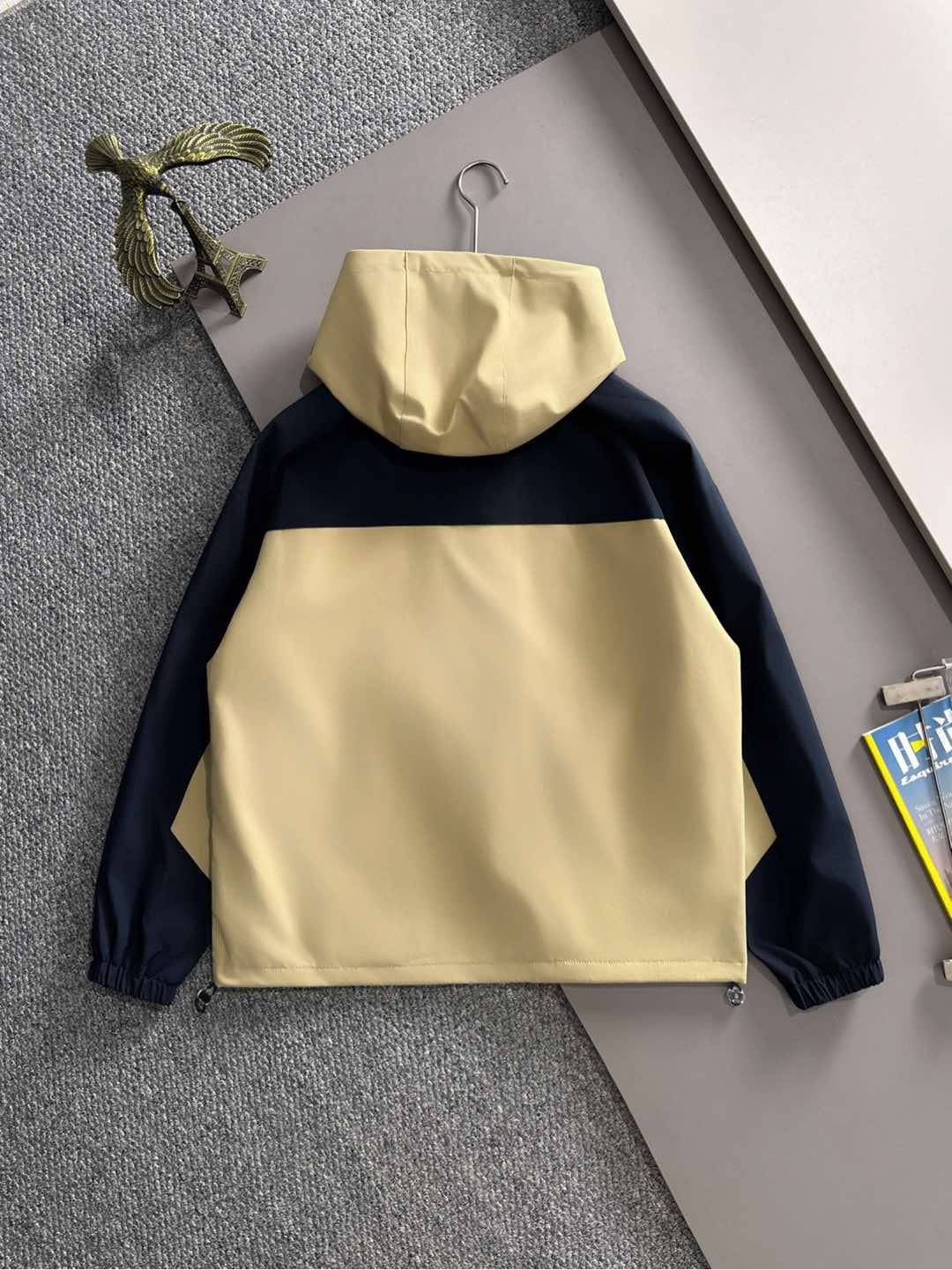 Hooded windbreaker jacket in navy with light yellow hood and front panel