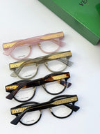 Bottega Veneta eyeglasses assortment in pink, olive, tortoise, and black with gold temples