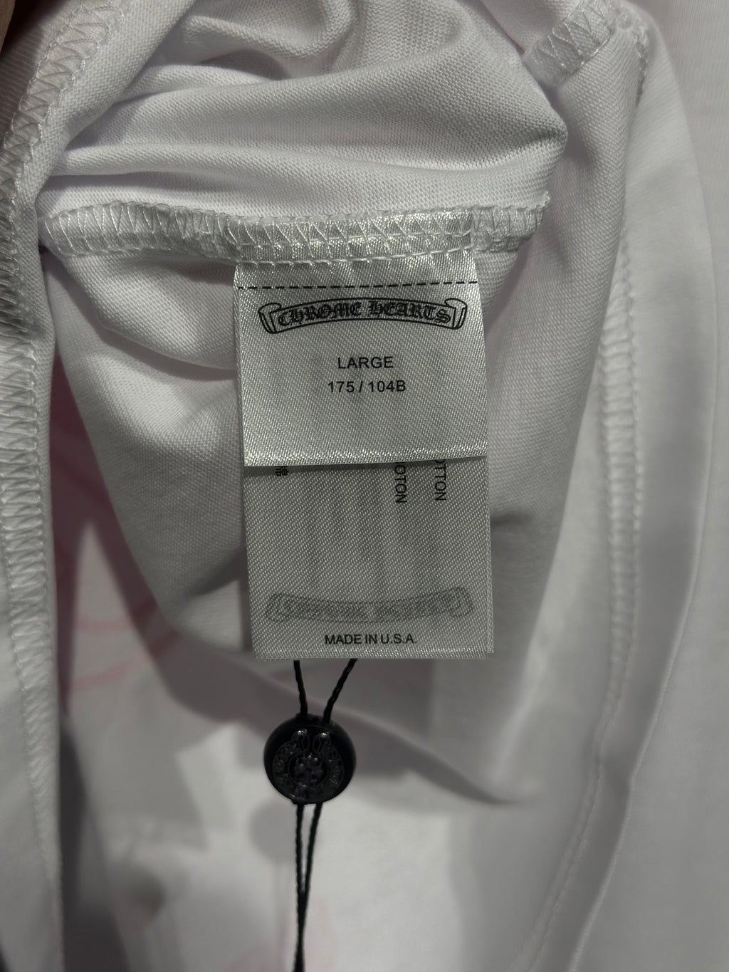 White long-sleeve shirt neck label and size tag