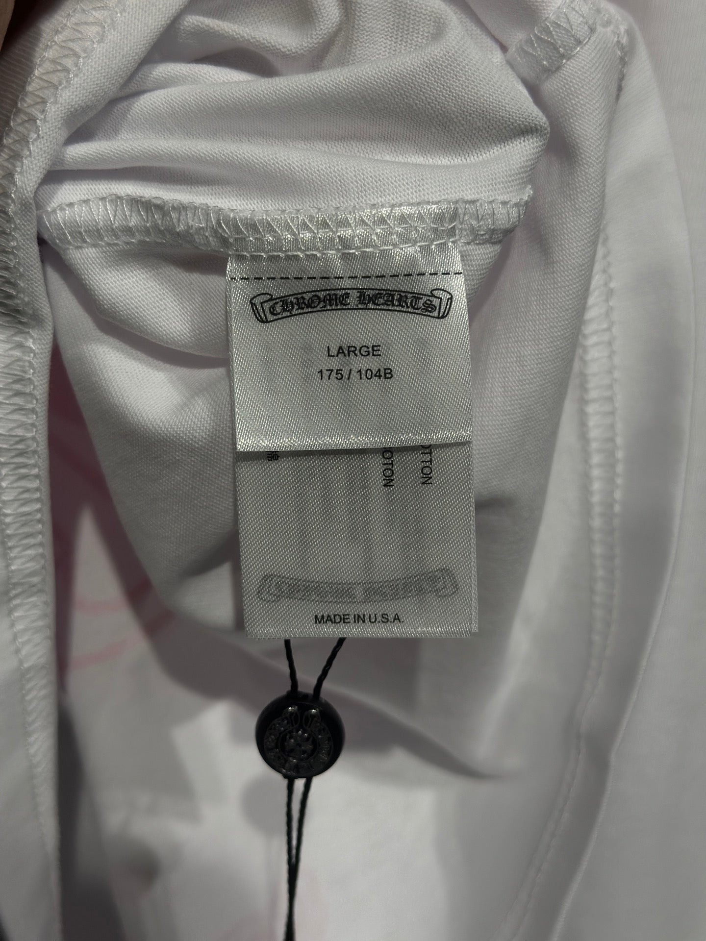 White long-sleeve shirt neck label and size tag
