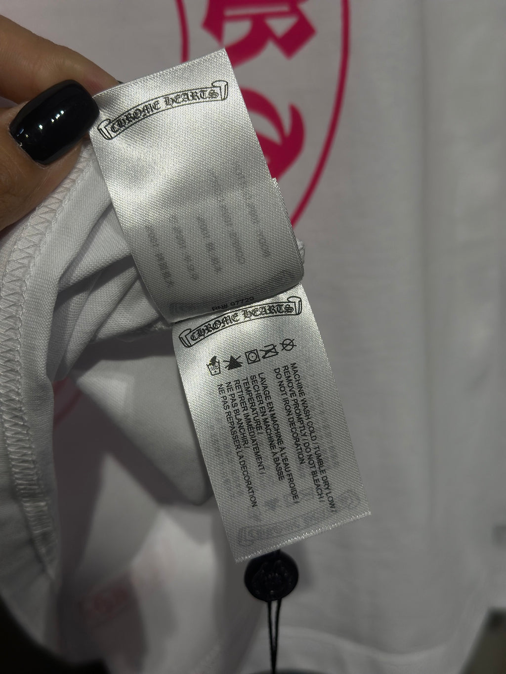 White long-sleeve shirt inner tag with care information