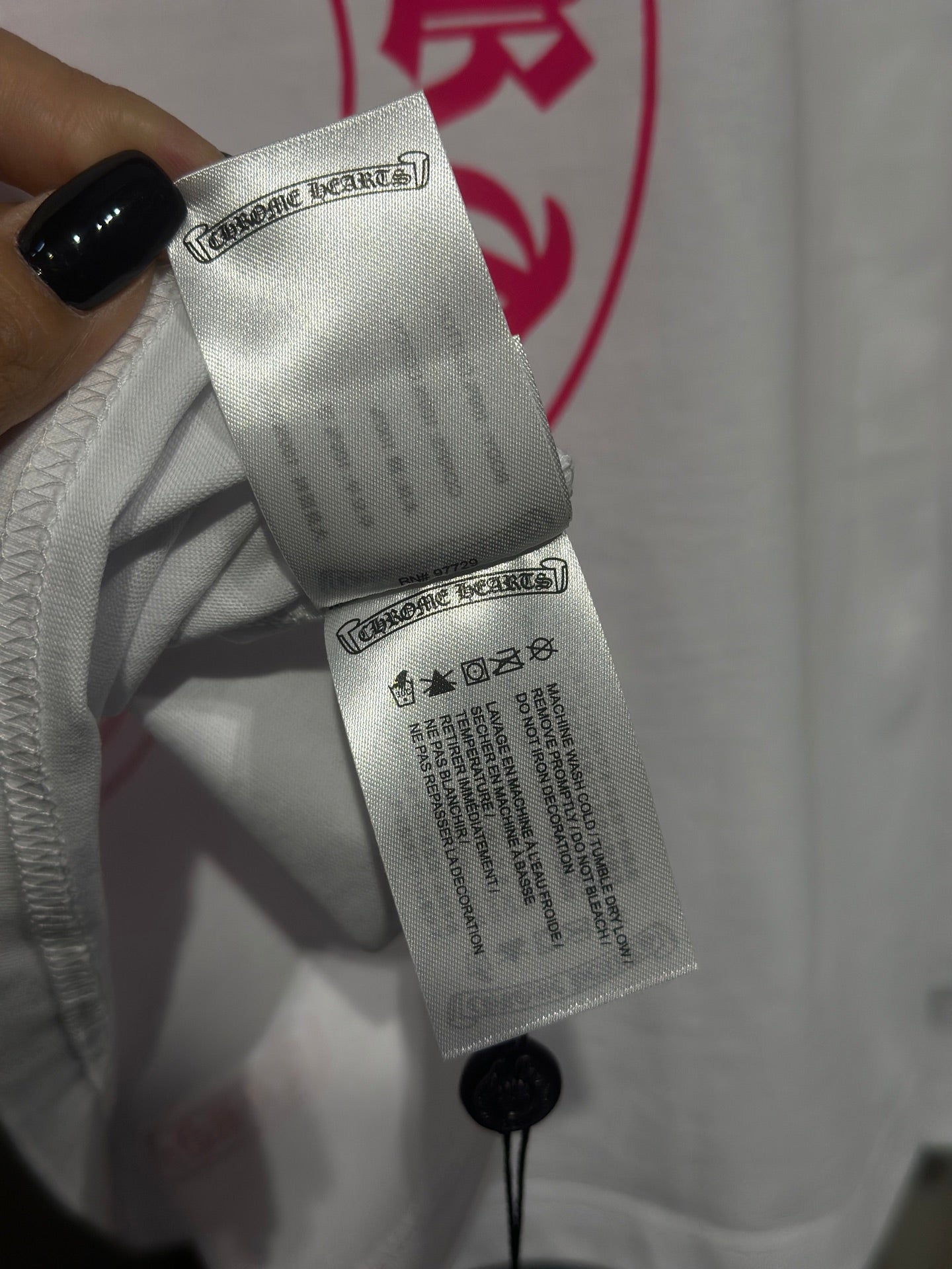 White long-sleeve shirt inner tag with care information