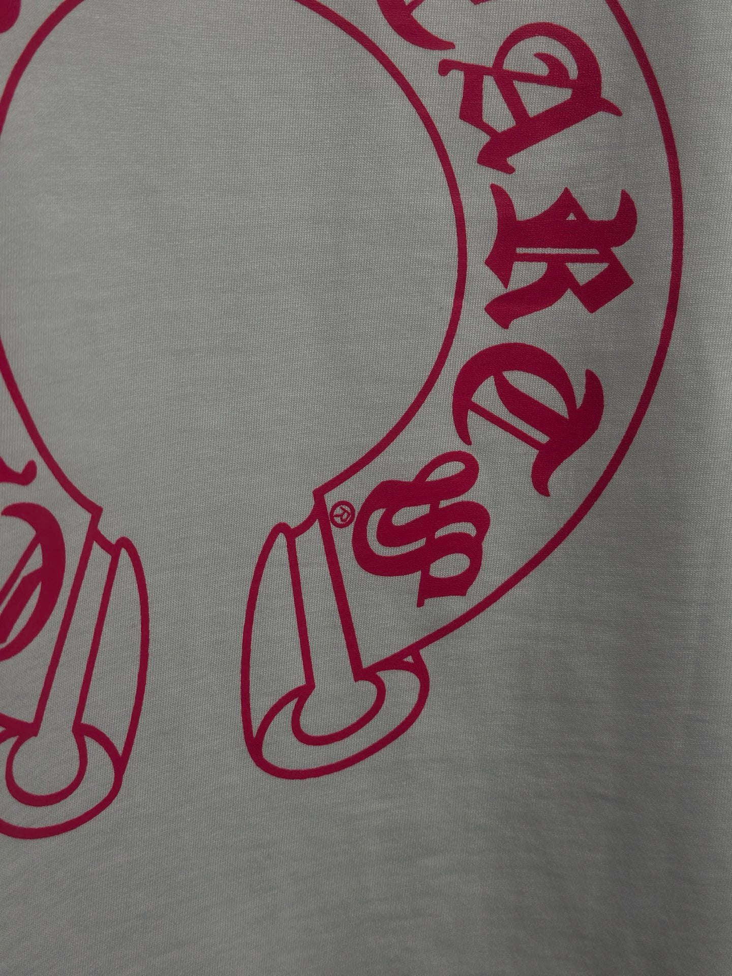 White long-sleeve shirt with red character graphic print