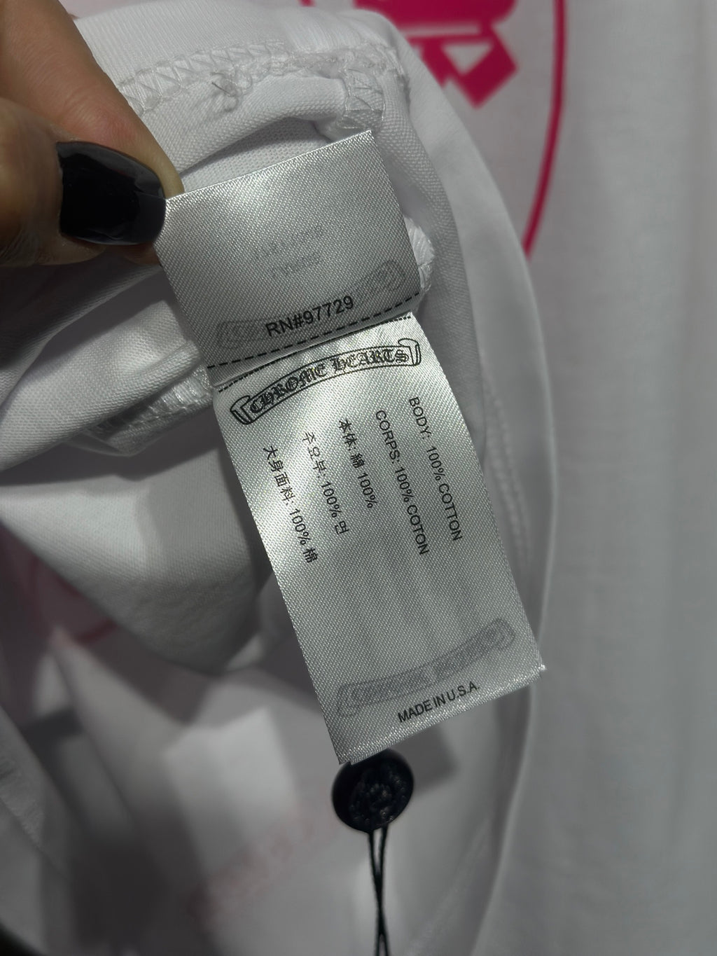 White long-sleeve shirt care label with string attachment