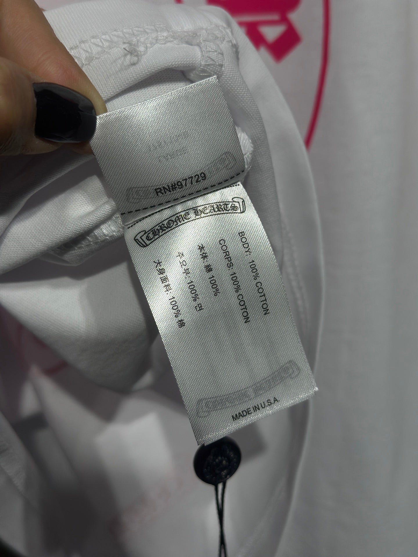 White long-sleeve shirt care label with string attachment