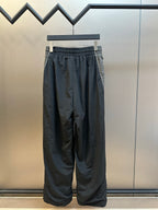Dark navy wide-leg pants with elastic waist and gathered drape at the thighs