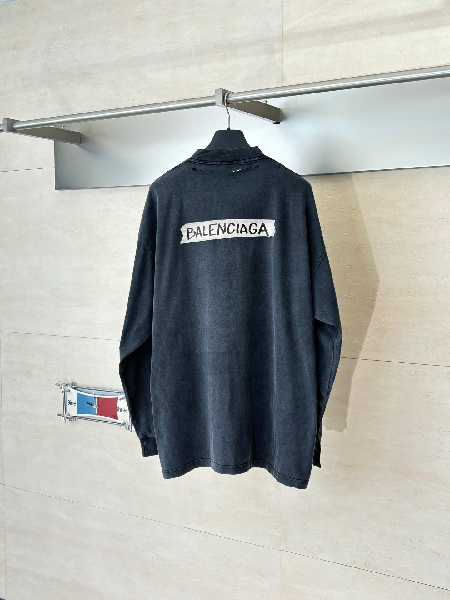 Balenciaga long-sleeve top, dark navy back with large white logo print