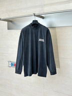 Balenciaga long-sleeve top, dark navy crew neck with small chest logo patch