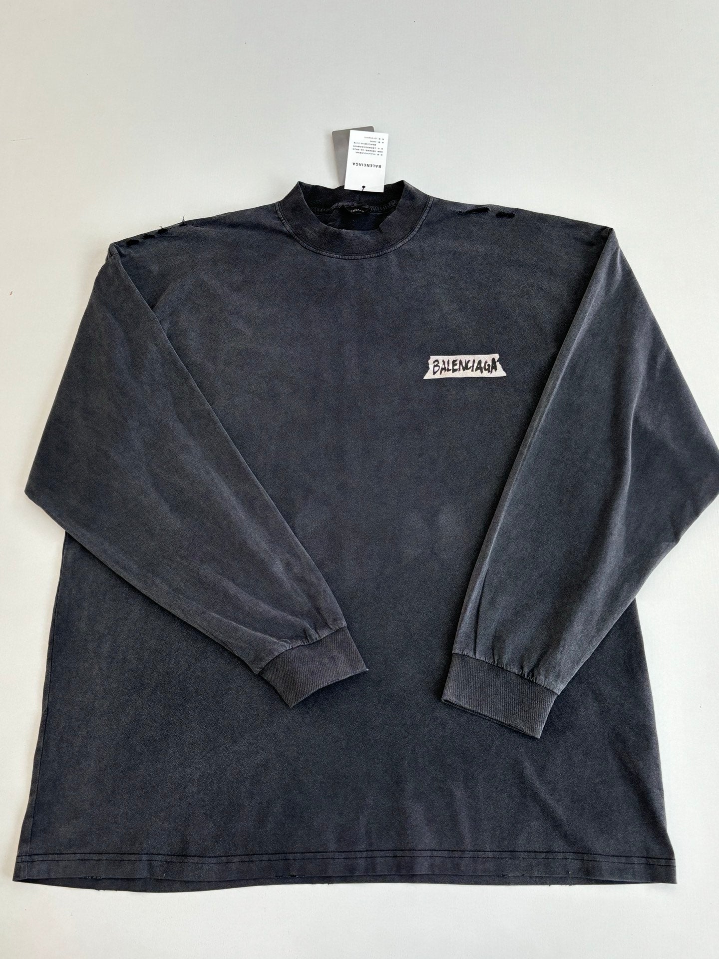 Balenciaga long-sleeve top, dark navy crew neck with small chest logo