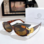 Versace sunglasses with dark lenses, tortoiseshell frame, and gold logo detail on the temple