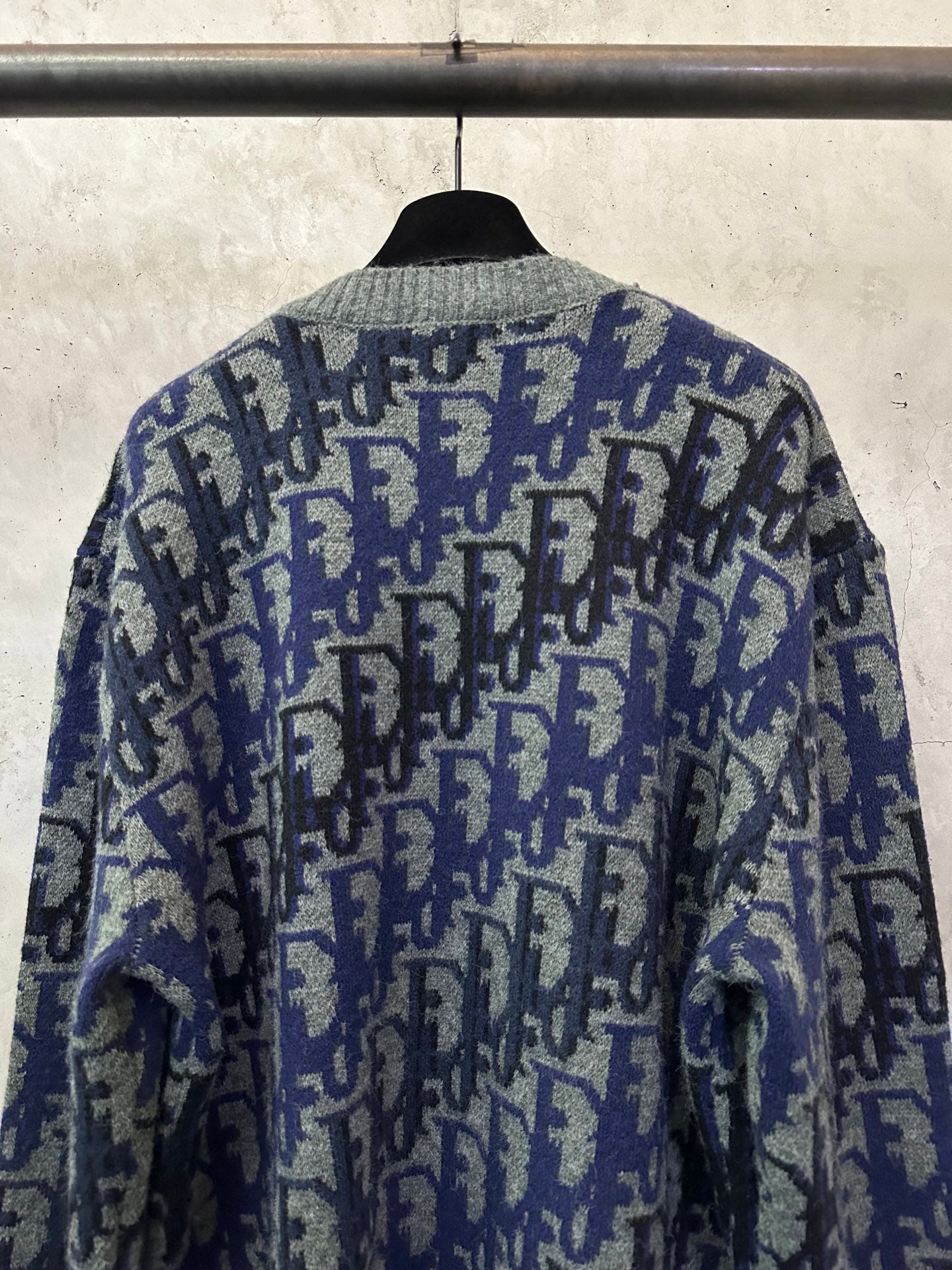 Dior long-sleeve knit sweater back view with blue and black allover logo pattern