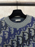 Dior knit sweater neckline close-up with gray ribbed collar and blue logo pattern