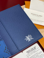 Blue Louis Vuitton wallet exterior with white emblem logo and stitching